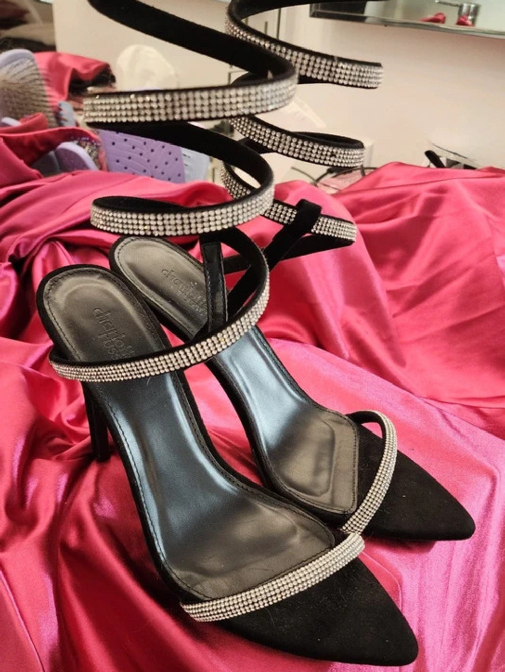 Sexy black pointed stiletto heels with a crystal-embellished spiral wrap.
